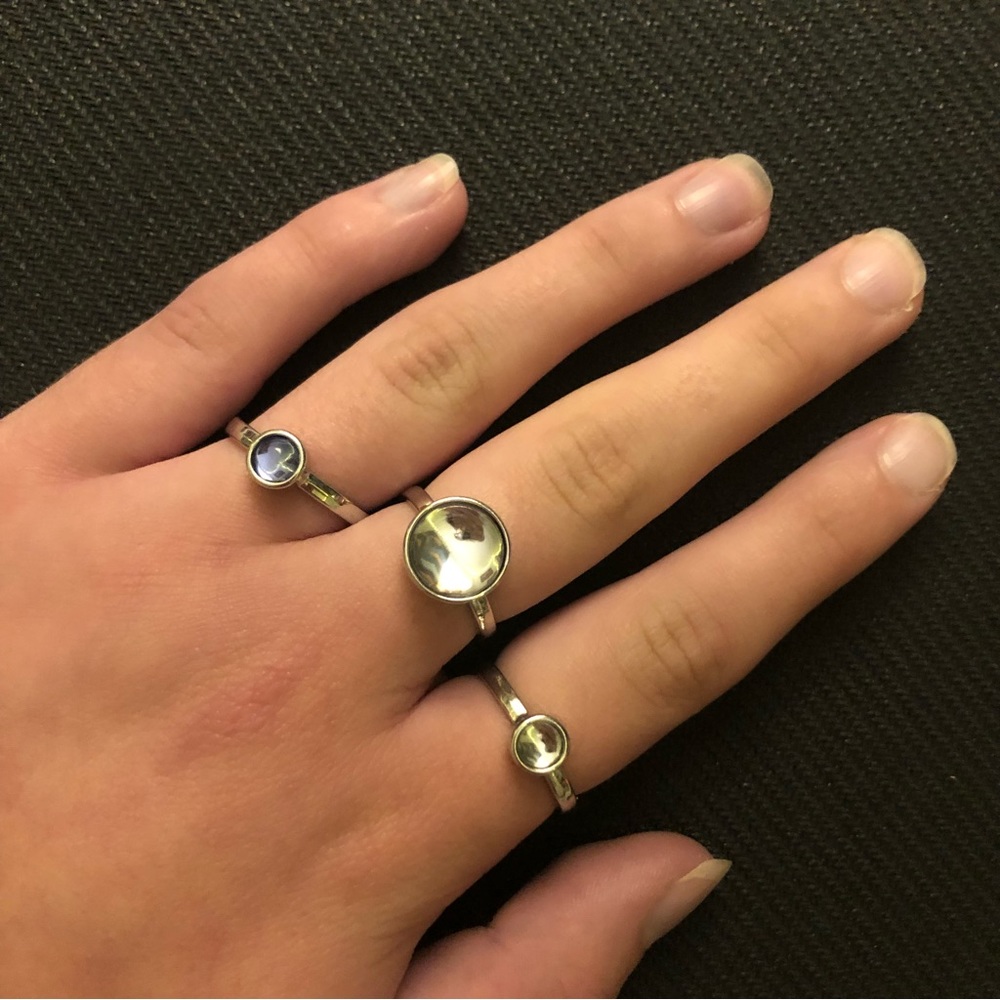 Set of three silver various sized circle centered rings